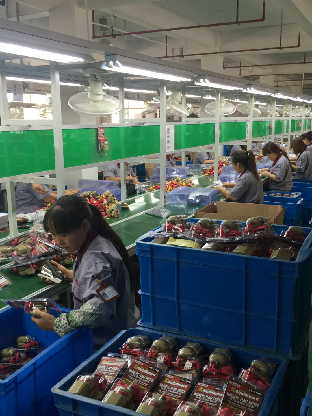 Team members assembling and inspecting components at the Jiashan factory