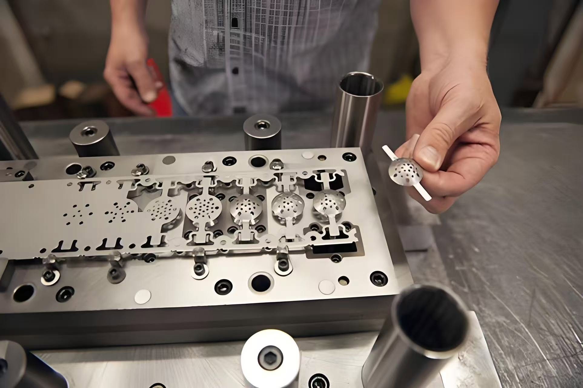 Technician checking precision parts in a tooling fixture